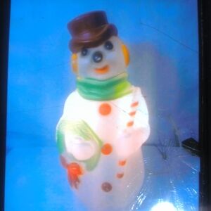 Charming Snowman Holiday Decor with Green Scarf and Brown Hat